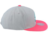 San Antonio Spurs gray and pink snapback hat featuring the team logo on the front and a flat brim design.