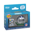 Front three-quarter view of a Dallas Cowboys Bitty Pop! helmet and player set in a blue retail box