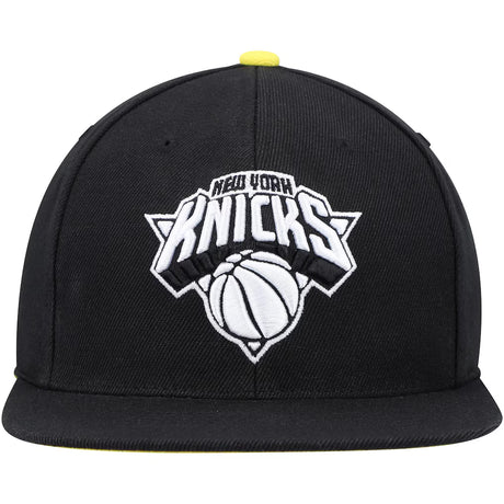 New York Knicks black and yellow snapback hat featuring an embroidered team logo and a flat brim design.