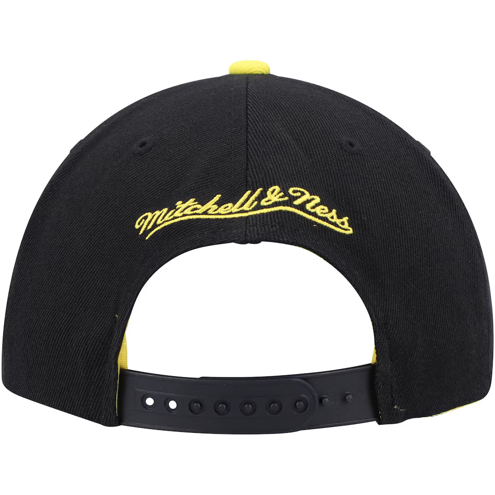 New York Knicks black and yellow snapback hat featuring a lightning hook design and Mitchell & Ness logo on the back.
