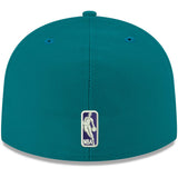 Teal Charlotte Hornets 59FIFTY fitted hat featuring the NBA logo on the back, perfect for fans and collectors.