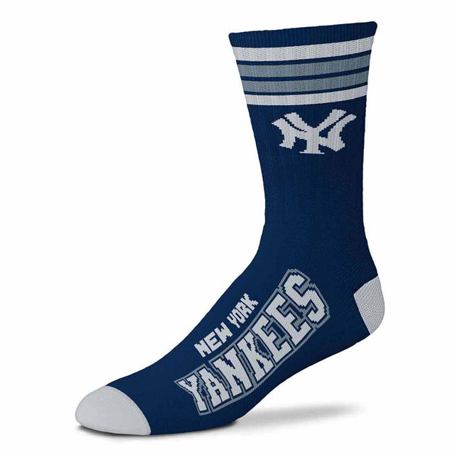 Angled view of brown Deuce performance crew sock with four striped cuff and gold Padres graphics on white background