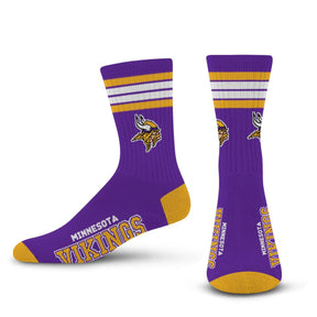 Side and front views of purple Minnesota Vikings 4-stripe crew socks with team logos and lettering on a white background