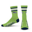 Front and back views of green Seattle Seahawks 4-stripe Deuce performance crew socks with team logos and text on white