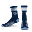 Front and side views of navy NFL Deuce performance crew socks with four stripes and Tennessee Titans graphics on white background