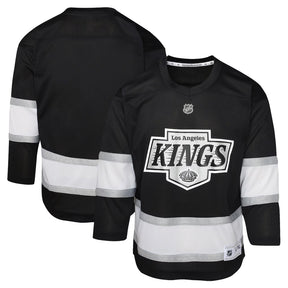 Youth Los Angeles Kings black home replica jersey featuring team logo and white stripes on sleeves. Perfect for young fans.